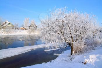 winter village on coast river 