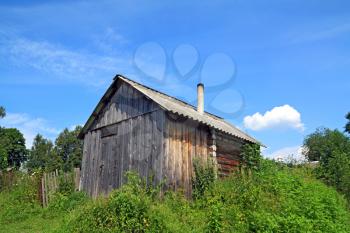wooden rural house amongst herbs