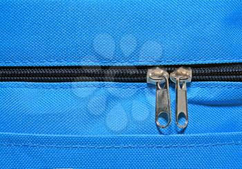 metallic zipper on blue fabrics