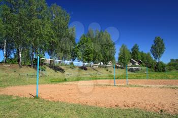 volleyball net amongst summer tree