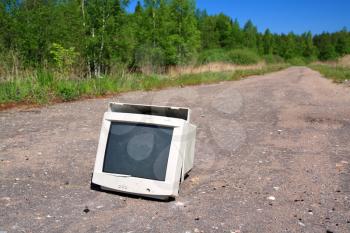 brokenned computer on old road