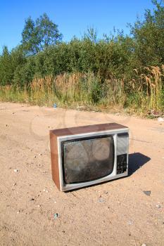 old television set on rural road