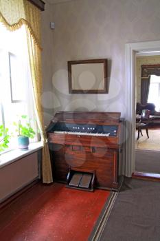 old harpsichord near light window