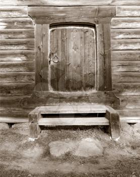 door in old wooden house, sepia 