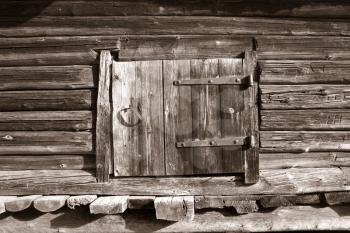 wooden door in rural barn, sepia