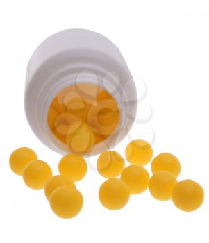 Vitamins scattered on a white background.
                   