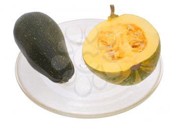 Cut and courgettes in a transparent plate on a white background.
                    