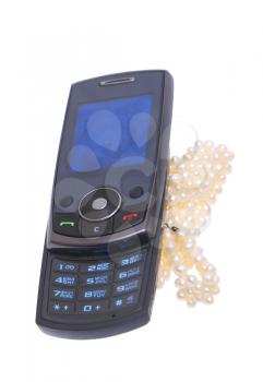 Mobile phone with pearls on a white background. 
                    