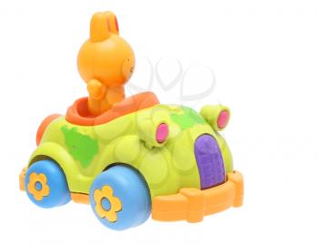 Toys, rabbit in the car on a white background. 
                  