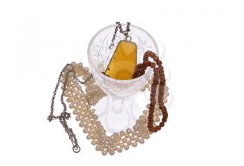 Women's jewelry - beads, framed amber, pearls and glass on a white background. 
                    