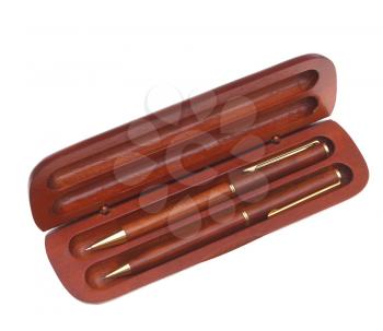 Pen and pencil in a wooden case on a white background.                  