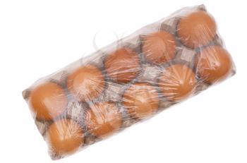 The eggs packed by transparent plastic on a white background.                   