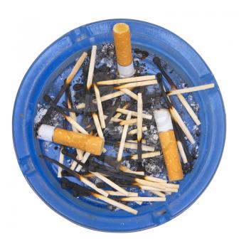 Ashtray with stubs and the burnt down matches on a white background.                    