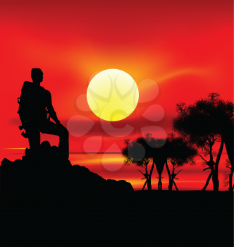 Royalty Free Clipart Image of a Silhouetted Backpacker on a Hill at Sunset