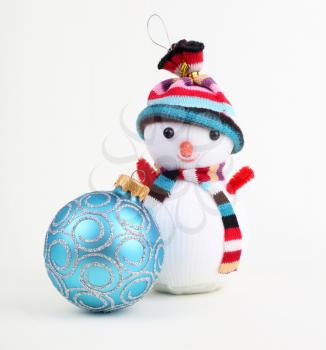 Christmas ball and snowman on white