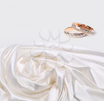 wedding rings on silk background