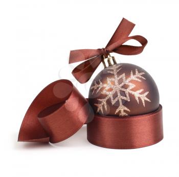 Christmas ball with ribbon and bow in chocolate tone.