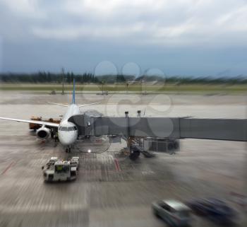 Airplane in airport. Blur motion effect.