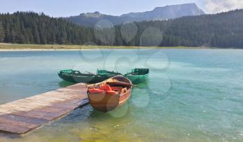 wood boat and lake