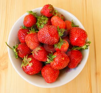 Ripe berry strawberry on wooden table.Ripe and juicy berry strawberries