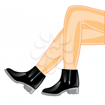 Beautiful feminine legs in black leather footwear