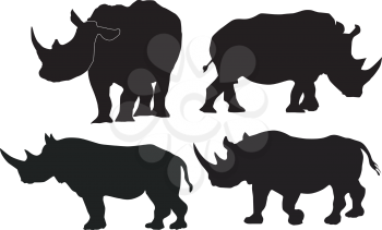 Royalty Free Clipart Image of Silhouettes of Rhinoceroses