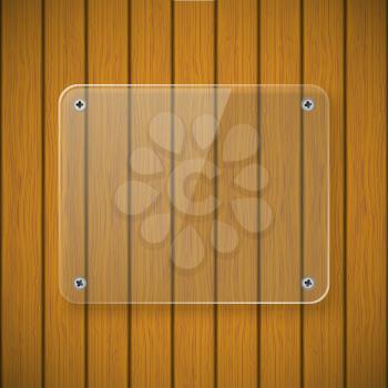Glass plate on the background of wooden wall