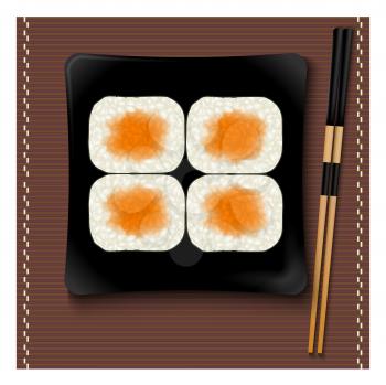 Black square plate with sushi and chopsticks