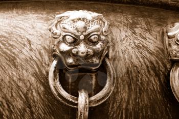 Ancient bronze lions as a handle of vat in Forbidden City