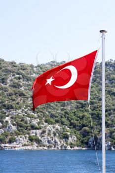 Royalty Free Photo of a Turkish Flag on a Boat in the Water