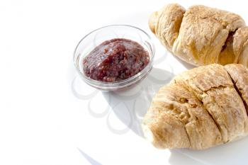 Two croissants with plum jam. Ideal for breakfast. 