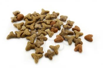 Close up image of dry cat food isolated on white background