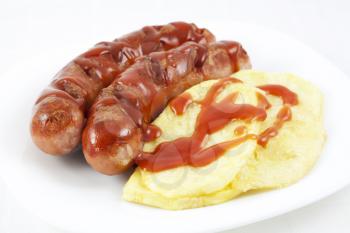 Fried sausages and potatoes with ketchup