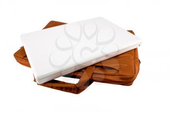 Orange bag and white laptop isolated on white background