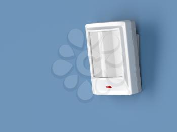 Motion detector attached on blue wall