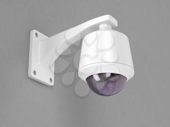 Surveillance camera attached on grey wall