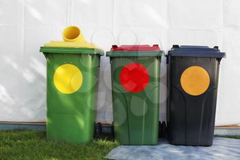 colored garbage bins to help separate and recycle