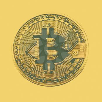 Bitcoin coin photo close-up. Crypto currency, blockchain technology on yellow background