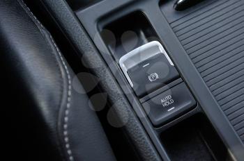 Electronic parking brake button in modern car