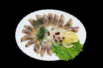 Dish with sliced herring, lemon and onion