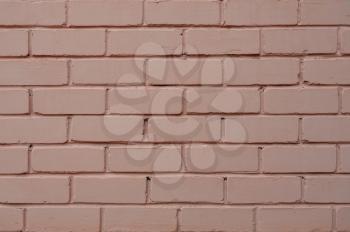 Painted brick wall of a powder color.