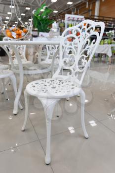 Beautiful wrought iron chair white lose up in a store