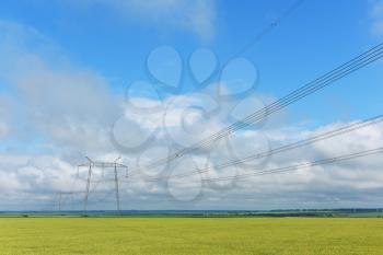 Very long wires and large power transmission poles.