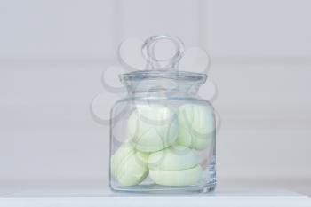 beautiful fresh marshmallows stored in a glass transparent jar,