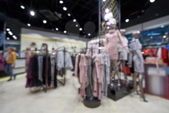 Beautiful blurred background of a women's clothing store in a mall.