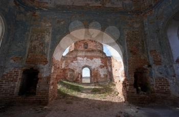Old abandoned church, shabby brick walls and an arch