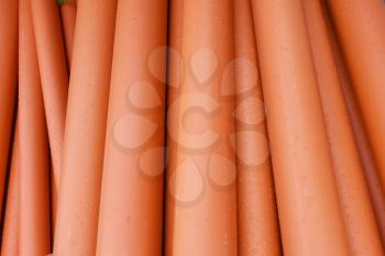 Large orange plastic pipes for sewerage system.