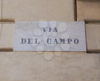 Tourists visiting Via del Campo street made famous by Italian musician Fabrizio de Andre in a well known song