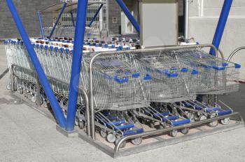 Row of supermarket shopping carts or trolleys