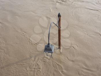 Street Lamp on Murazzi bank of River Po submerged in water due to flood in city centre in Turin, Italy